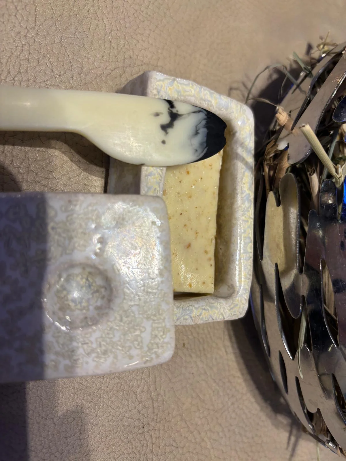 Close-up of Beurre de Madame showing its golden colour and dense, creamy texture in the ceramic dish
