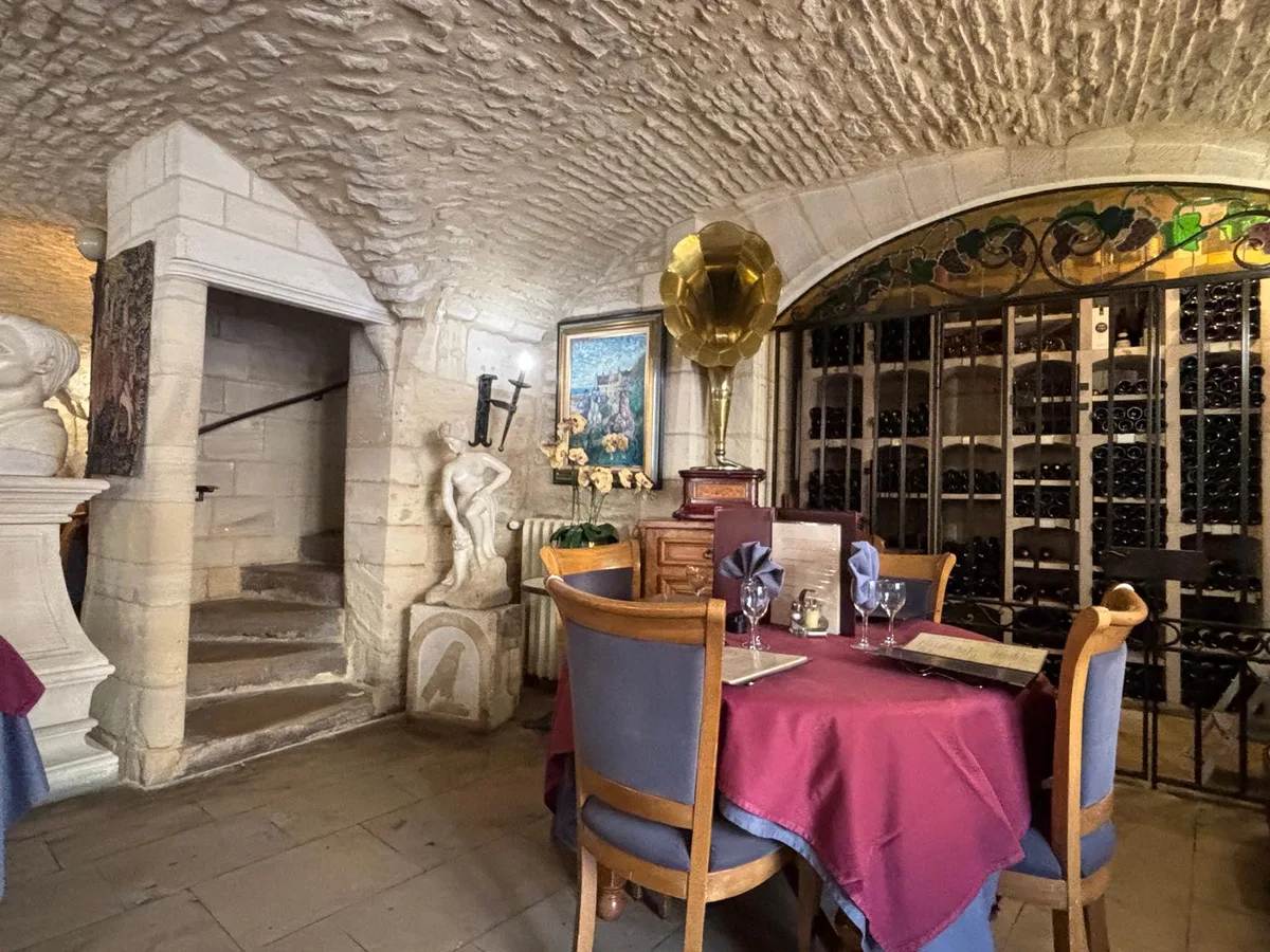 The vaulted cellar dining room with brass gramophone and wine cellar