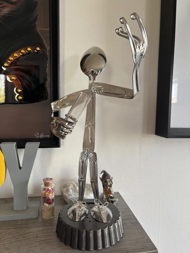 Polished metal figurine sculpture made from recycled steel by artisan Benjamin