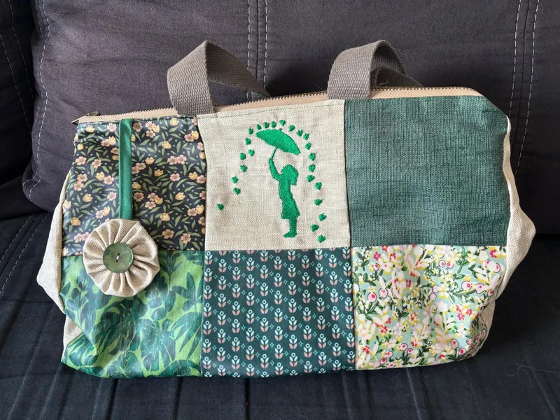 Patchwork tote bag in green tones with umbrella girl motif by Hermine Goutelette