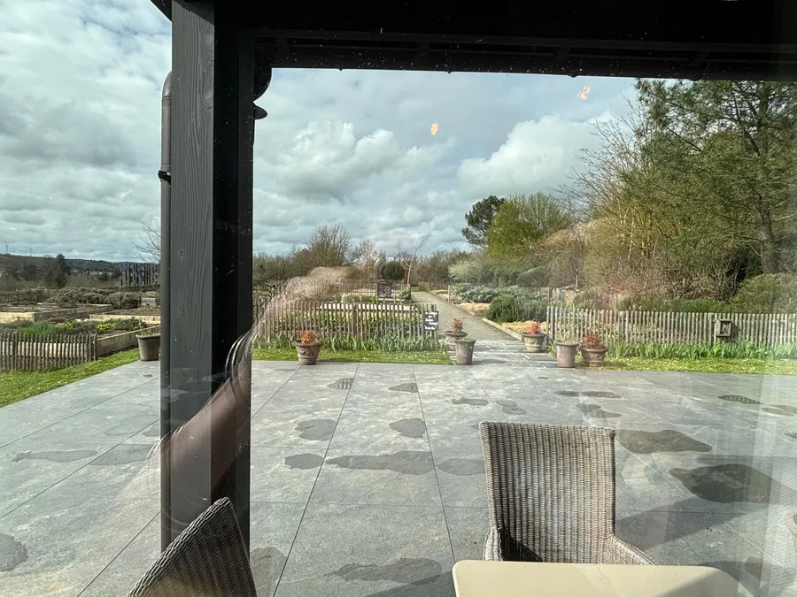 View of the hotel garden through floor-to-ceiling windows