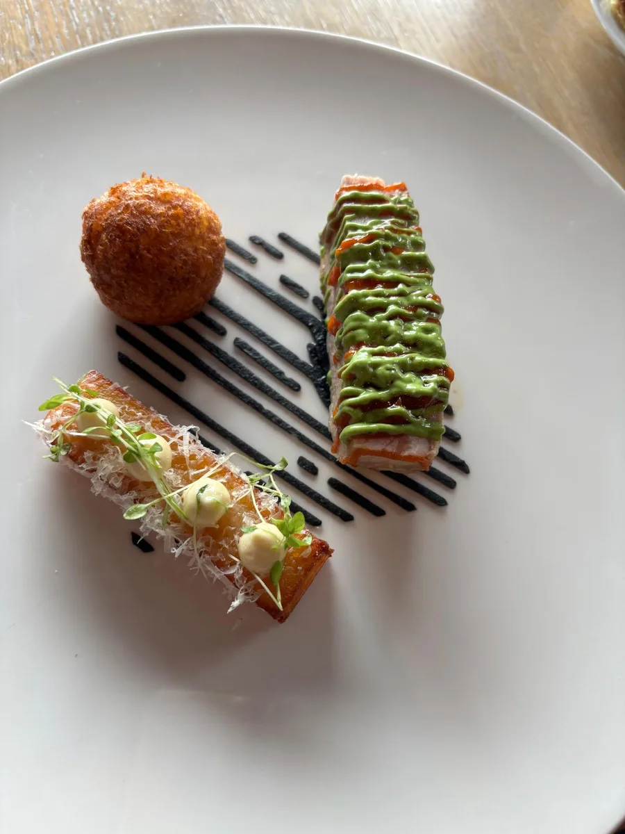 Elegant starter with green herb stripes and golden croquette