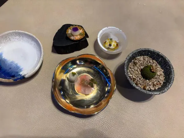 Four amuse-bouches in artisanal ceramic vessels