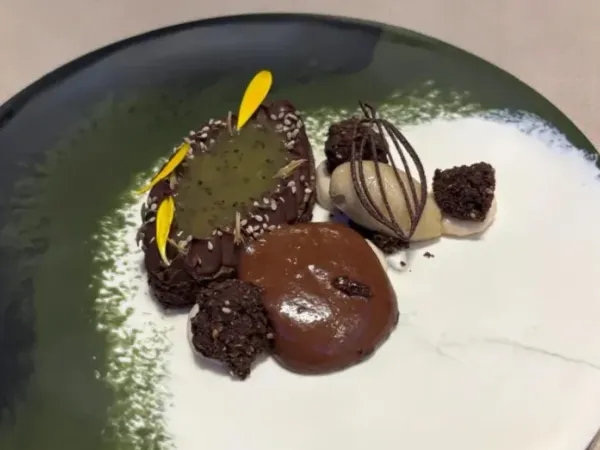 Chocolate dessert on green ceramic plate