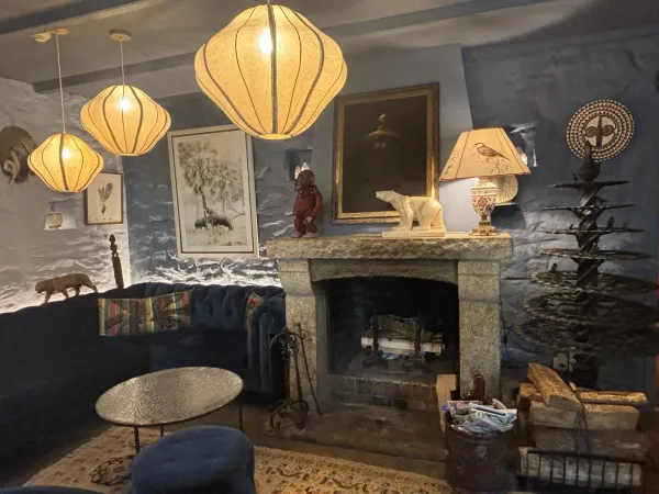 Lounge with stone fireplace and cloud lamps