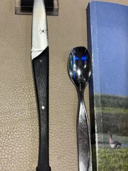 Morta wood knife and Georgette spoon on leather tablecloth