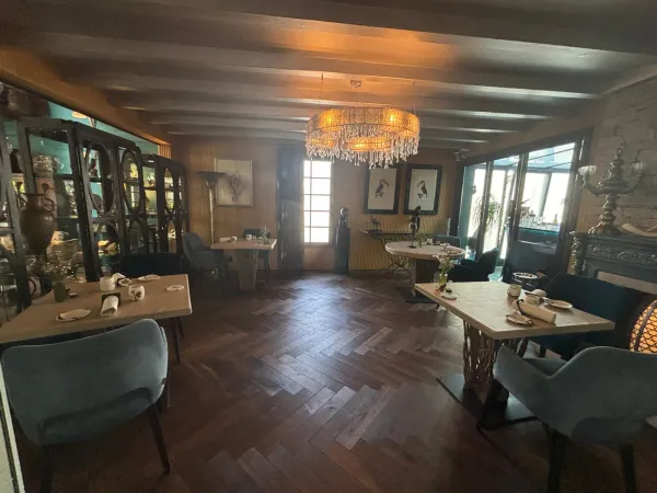 Grande salle with chandelier and herringbone parquet