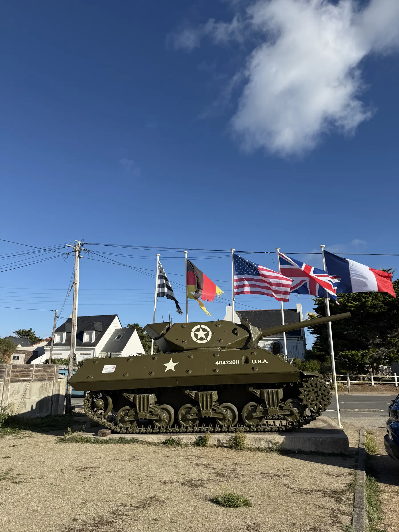 M10 tank destroyer and Allied flags at Batz-sur-Mer